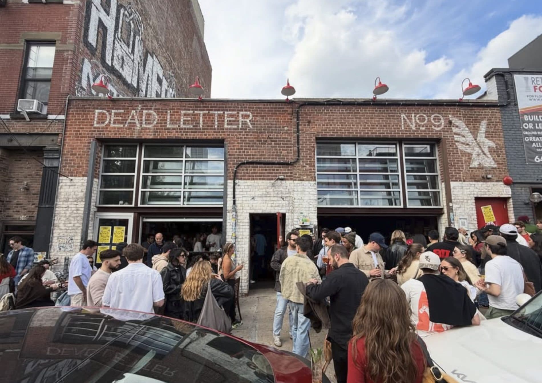 Crowd gathered outside Dead Letter No. 9 during an Arroces neighborhood event