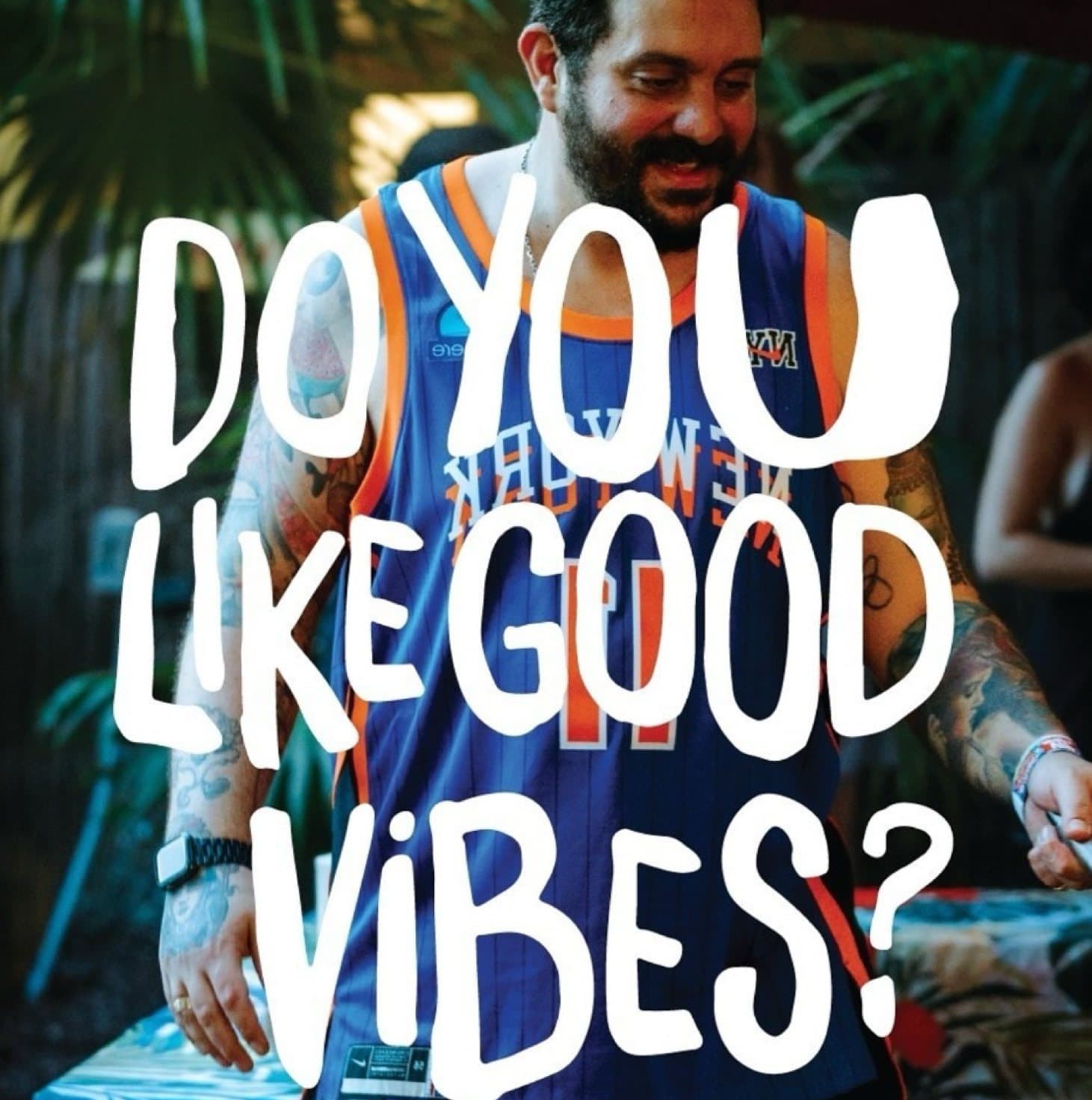 Chef Ed smiling outdoors in a Knicks jersey with good vibes energy