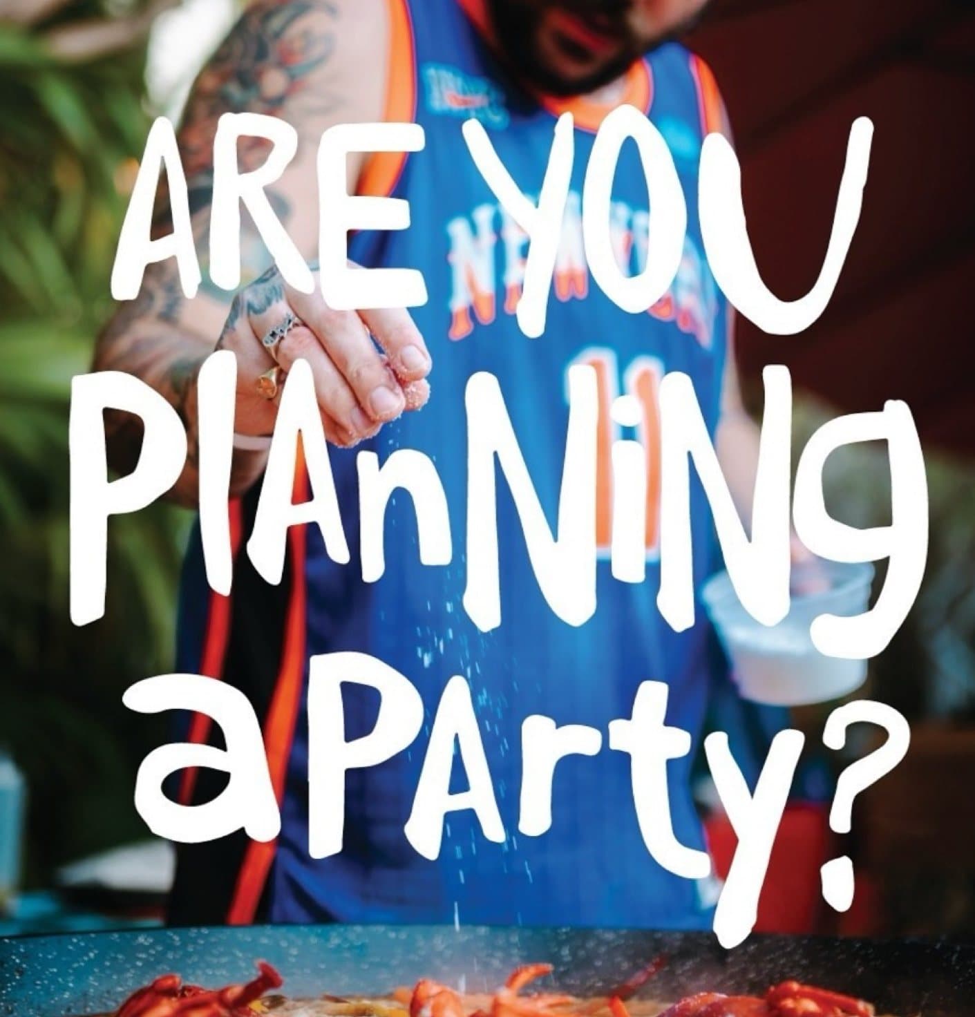 Chef seasoning a lobster paella while text asks if you are planning a party